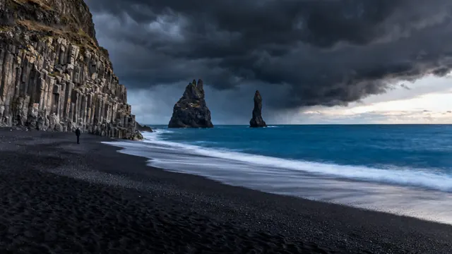 Basalt sea stacks on a black sand beach