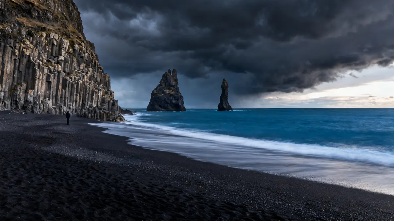 Basalt sea stacks on a black sand beach